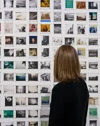 Woman Looking at Photographs at Pace Gallery @ ICP